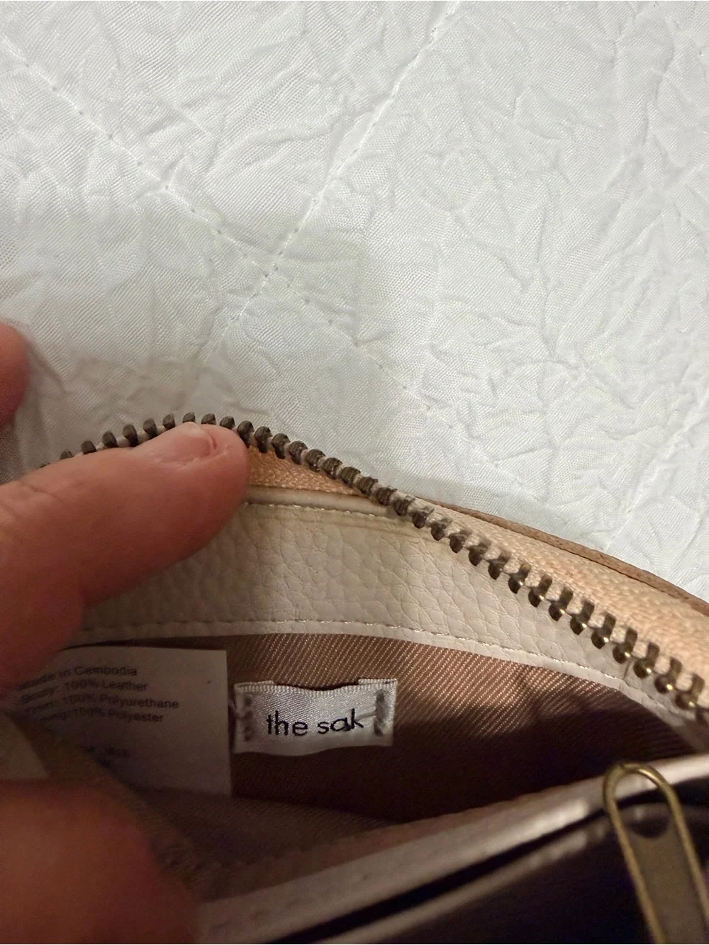 The Sak Metallic Rose Gold Compact Zip Wallet